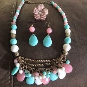 Matching pastel necklace, earring and ring set.